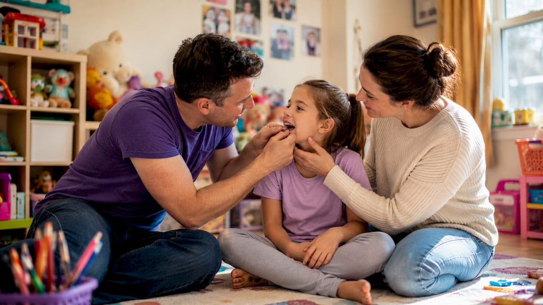 Parents fitting night guard on child