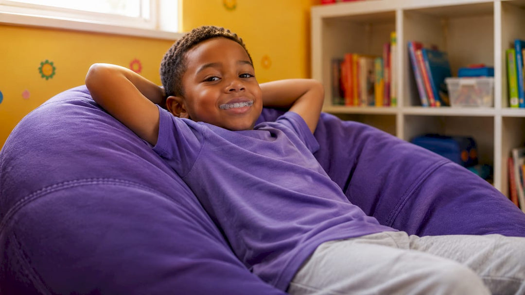 Child wearing night guard in bedroom