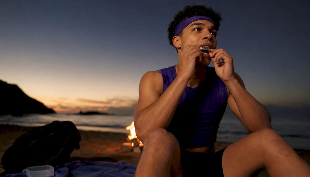 Athlete fitting mouthguard on outdoor court