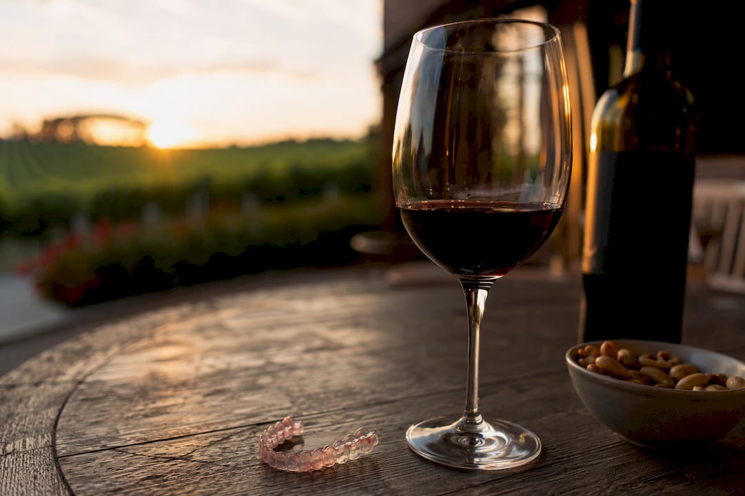 Red wine glass with slight stain near dental tray
