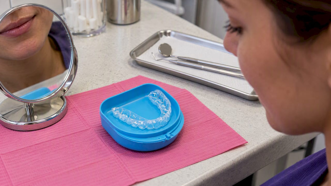 Clear retainer inspected for gum irritation